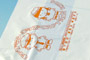 セミオーダーオリジナルレジ袋30号 ■ 本体色：乳白 ■ 印刷色：茶＆金＆緑＆橙 ■ 使用目的：ショップ